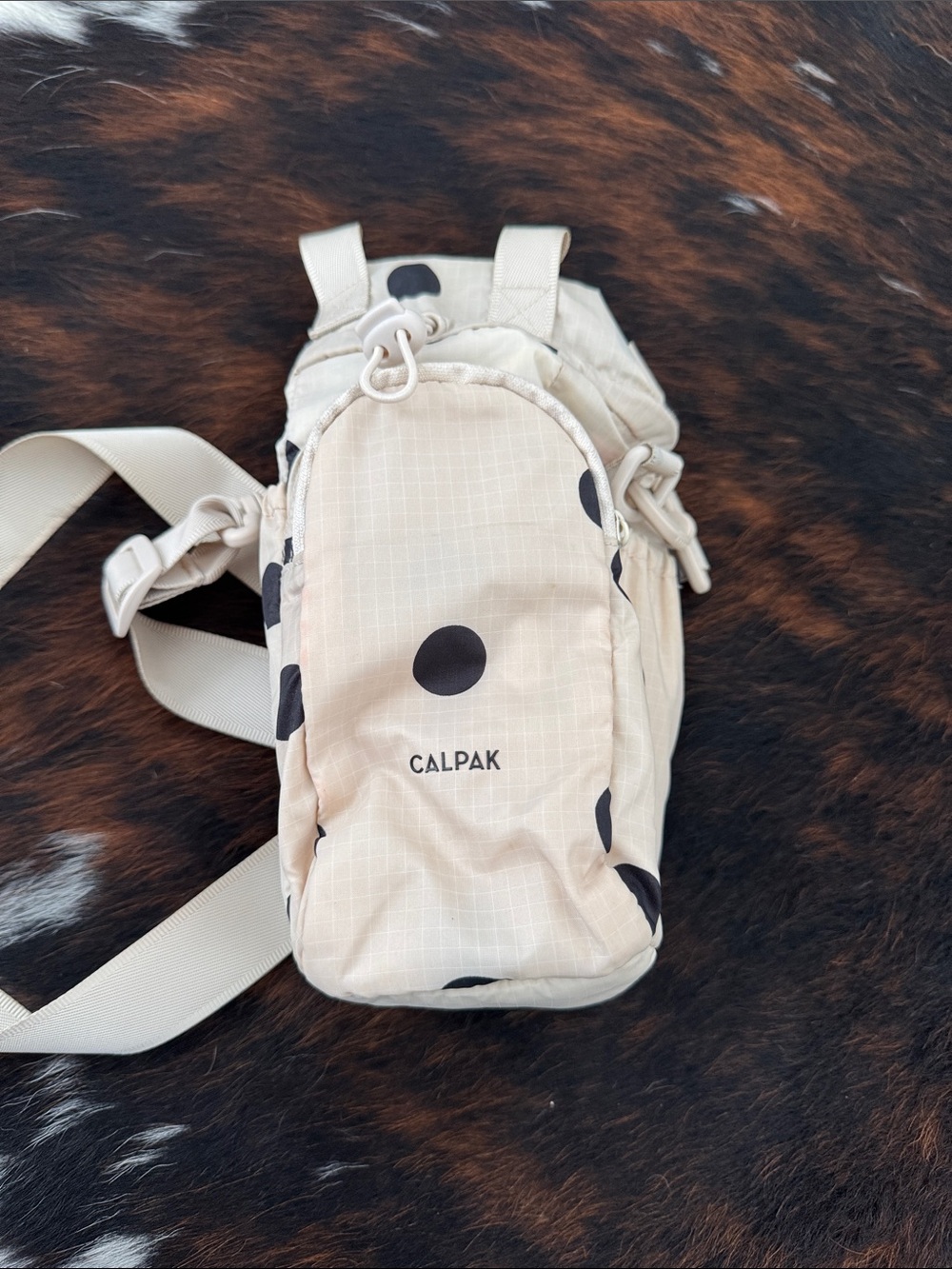 CALPAK Beige Polka Dot Waterbottle Crossbody Bag